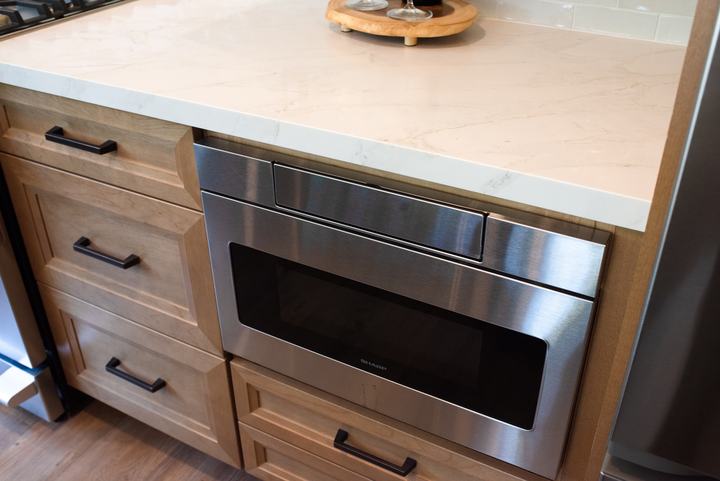 Stainless microwave drawer built in below the quartz countertop
