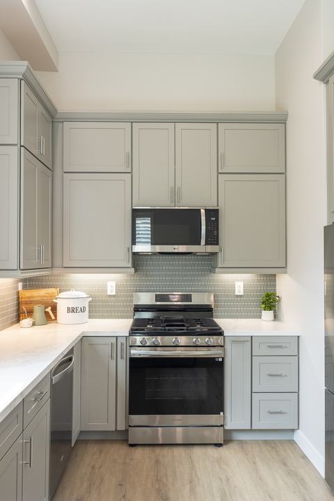 Full elevation of range wall with shaker uppers