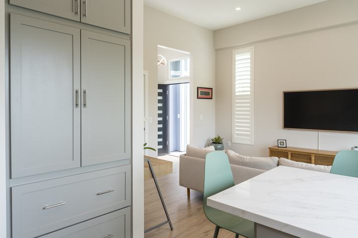 Tall pantry cabinets with view to entry and living