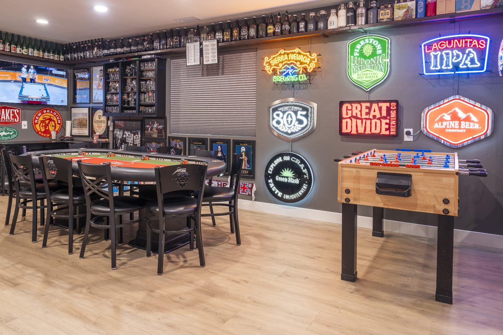 Neon brewery wall with foosball and poker table