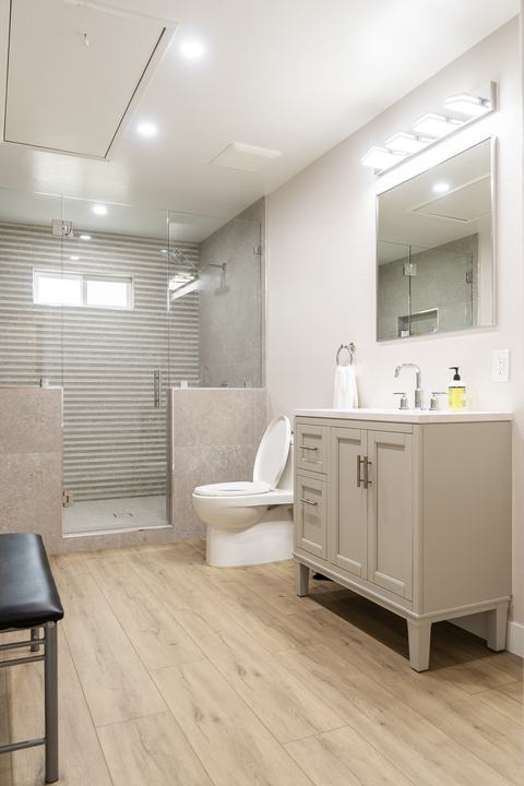 New full bath with large walk-in shower and vanity