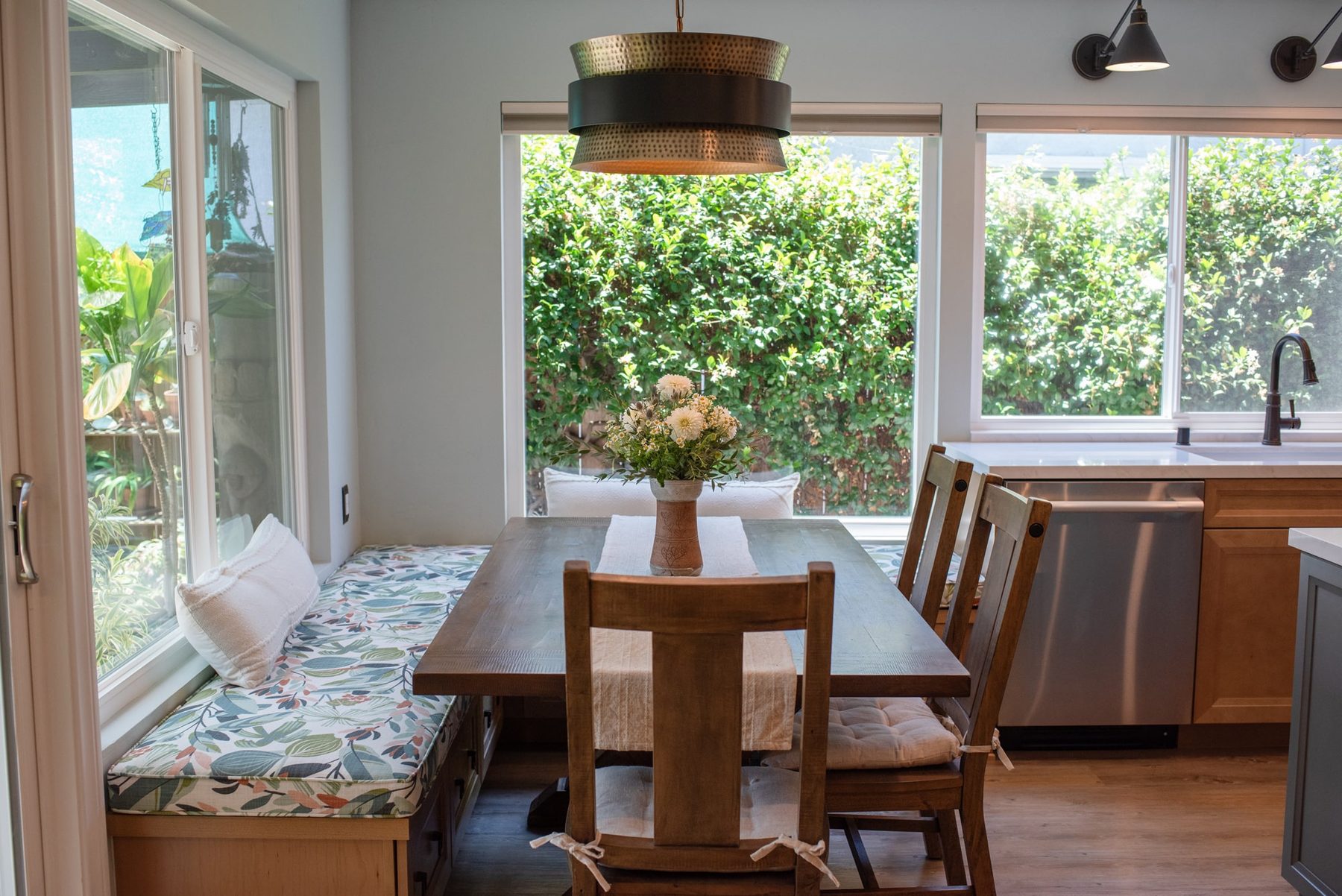 Built-in banquette bench seating with storage drawers in a remodeled Mira Mesa kitchen