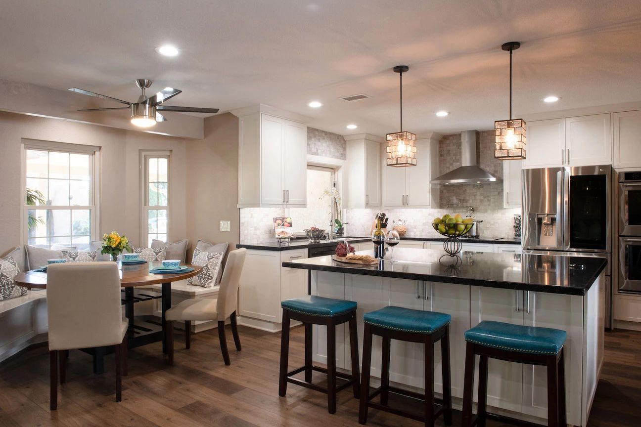 Whole home remodel in San Diego with an open kitchen, island seating and dining room