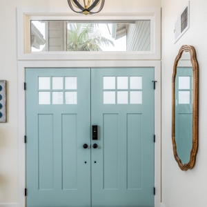 Surf-blue double entry doors and pendant light