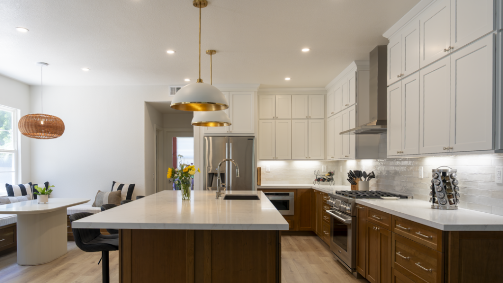 Kitchen with stained wood island and painted white perimeter cabinets