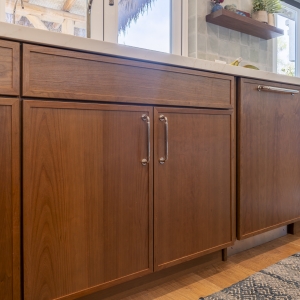 Long sink run with drawer bases and panel fronts in Cherry Amber under the expanded window