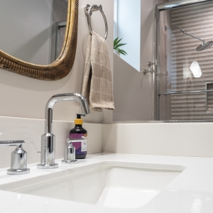 Rectangular sink with chrome widespread faucet and backsplash