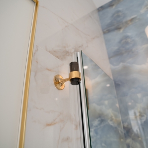 Black and brass robe hanger closeup