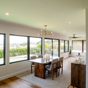 Dining and living area with wide windows in a Rancho Bernardo addition remodel