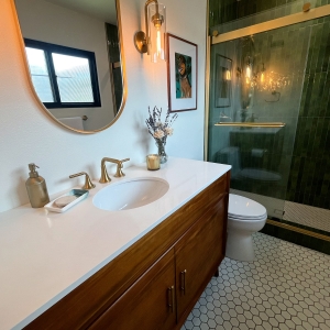 Wide view of the primary bathroom vanity and shower